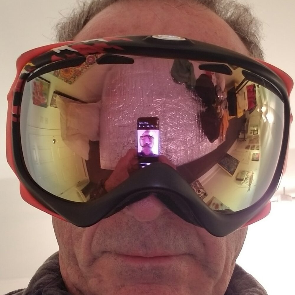 Oakley Orange Yellow and Black Snow Goggles with Yellow-tinted Reflective Lens.